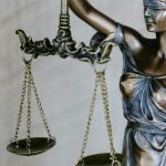 A sculpture of Lady Justice holding scales
